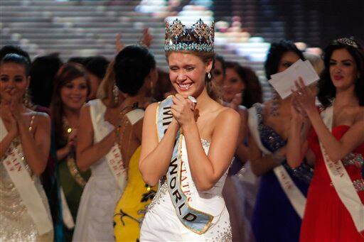 Alexandria Mills of the US, front center, reacts after being crowned as winner of the 2010 Miss World pageant contest at the Beauty Crown Cultural Center in Sanya.