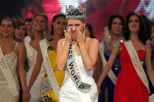 Alexandria Mills of the US, front center, reacts after being crowned as winner of the 2010 Miss World pageant contest at the Beauty Crown Cultural Center in Sanya.