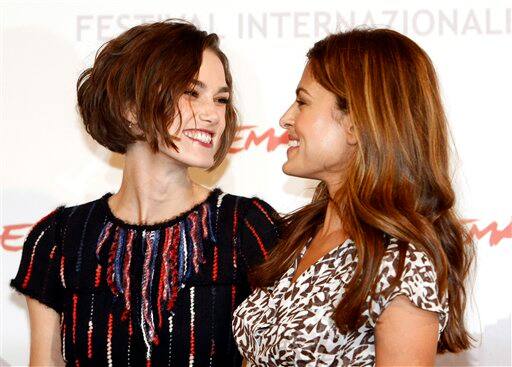 British actress Keira Knightley, left, smiles at American actress Eva Mendes during the photo call of the movie 