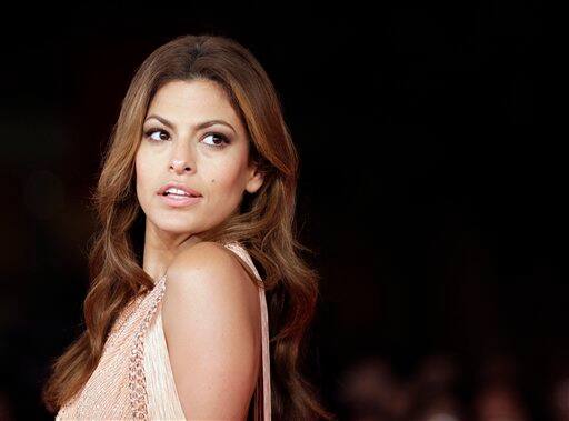 Actress Eva Mendes poses on the red carpet as she arrives to attend the screening of the movie 