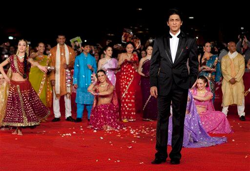 Indian actor Shah Rukh Khan arrives on the red carpet to attend the screening of his movie 