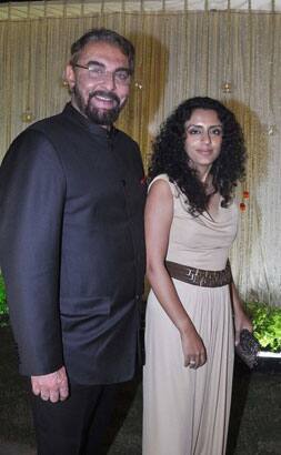 Indian Bollywood actor Kabir Bedi (L) poses with Parveen at newly wed Vivek Oberoi and Priyanka Alva's reception party in Mumbai.