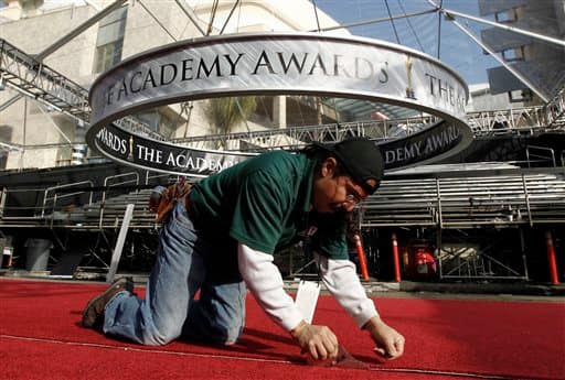 Rudy Morales prepares the red carpet for the 83rd Academy Awards outside the Kodak Theatre in Los Angeles.