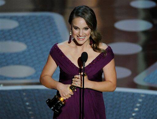 Natalie Portman accepts the Oscar for best performance by an actress in a leading role for 