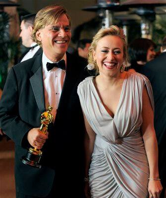 Writer Aaron Sorkin, left, is seen with his academy award for 