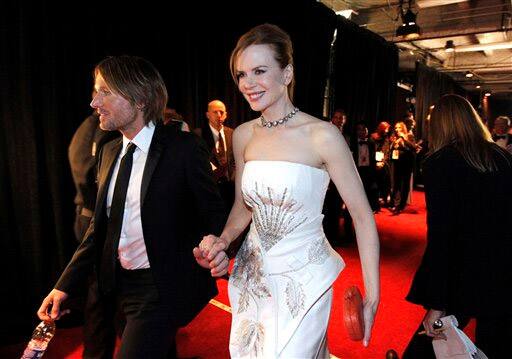 Keith Urban, left, and Nicole Kidman are seen backstage at the 83rd Academy Awards.