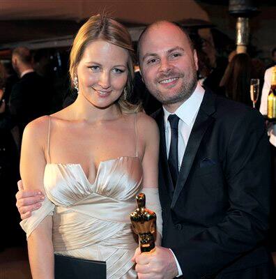 Andrew Lockley, right, is seen with his academy award for best visual effects for 