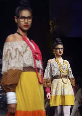 Indian models display designer Sabyasachi Mukherjee creations during the Lakme Fashion Week in Mumbai.