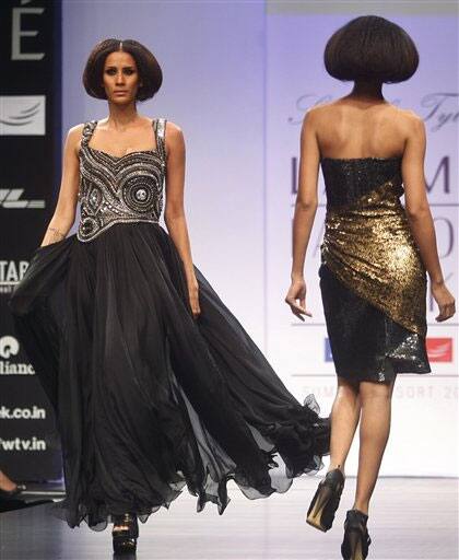 Indian models display designer Siddartha Tytler's creations during the Lakme Fashion Week in Mumbai.