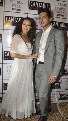 Bollywood personalities Dia Mirza (L) and Zayed Khan attend the fourth day of 2011 Lakme Fashion Week.