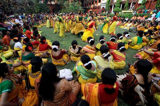 Students of Rabindra Bharati University dance during Holi festival celebrations at the residence of India's first Nobel laureate Rabindranath Tagore in Calcutta.