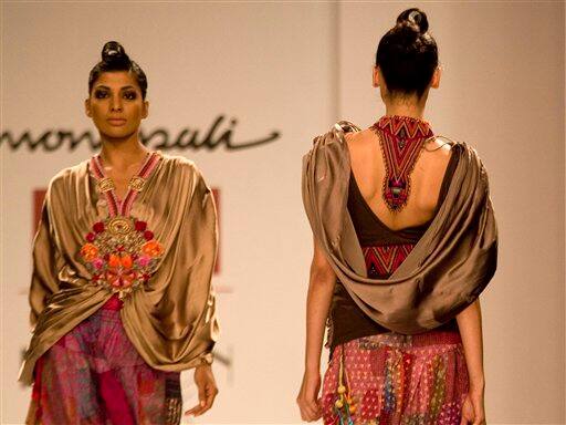 Models display creations by Indian designer Monapali during Wills Lifestyle India Fashion Week in New Delhi.