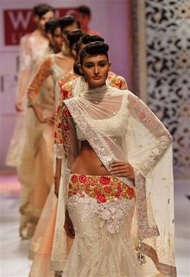 Indian models display designer Manish Malhotra's creations during the Wills Lifestyle India Fashion Week, in New Delhi.