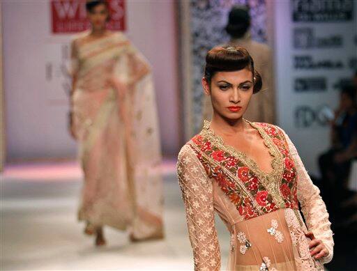 Indian models display designer Manish Malhotra's creations during the Wills Lifestyle India Fashion Week, in New Delhi.