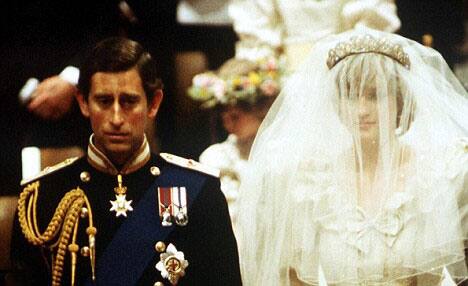 The Royal Lady has her pretty face covered with a vail walks with her then husband to be, Prince Charles.