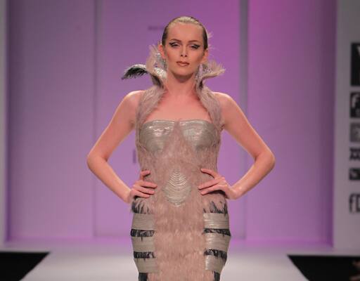 On day 5 Khushali Kumar openedthe show with beige feathered dress with high collar.