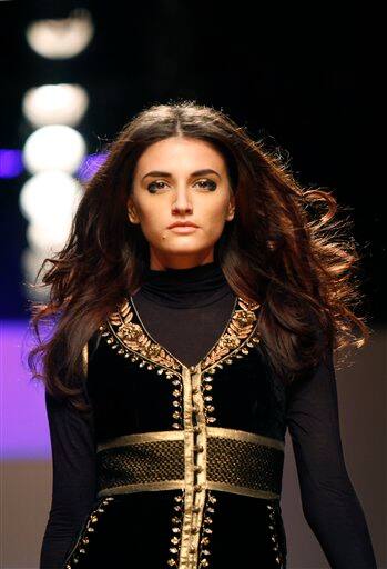 A model presents a creation by Anita Dogre at the India Fashion Week in New Delhi.