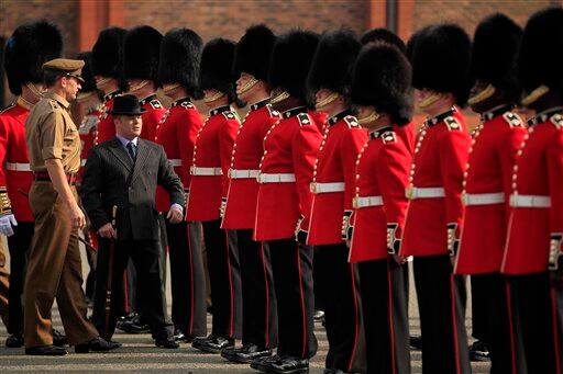 Master Tailor Lance Sergeant Matthew Else, in suit, takes part in a ceremonial inspection ahead of the royal wedding.