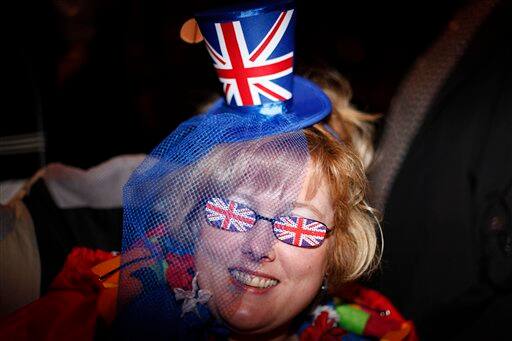 Charlie Lancaster, from Kent, camps overnight on a Royal Wedding route near Westminster Abbey in London.