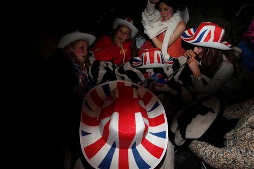 Young royal enthusiasts from Kent and Yorkshire camp overnight on the Royal Wedding route near Buckingham Palace in London.