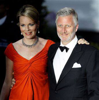 Belgium's Crown Prince Philippe, right, and his wife Princess Mathilde arrive for a pre-royal wedding dinner hosted by Lady Elizabeth Anson and attended by British and foreign royal families, London.