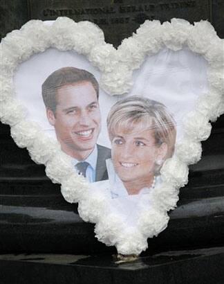 A picture of Britain's Prince William and his mother Princess Diana is seen at the memorial above the Alma underpass where she died on August 31, 1997, in Paris.