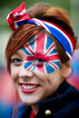 Royal enthusiast from Bedfordshire poses at the junction of the Mall and Horse Guards Road for the Royal Wedding in London.