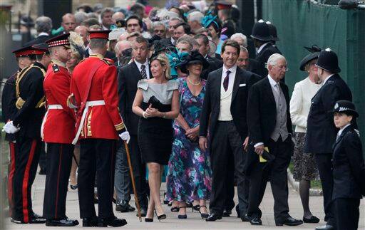 People wait to enter Westminster Abbey prior to the Royal Wedding in London.