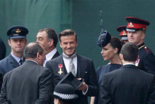 British soccer player David Beckham and his wife Victoria Beckham arrive at Westminster Abbey for the Royal Wedding in London.