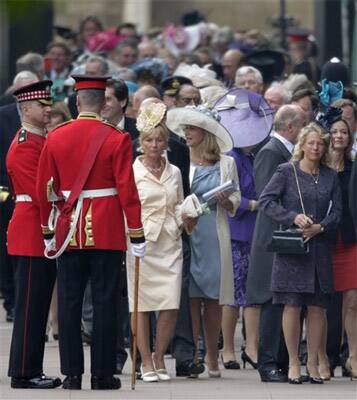 People wait to enter Westminster Abbey prior to the Royal Wedding in London.