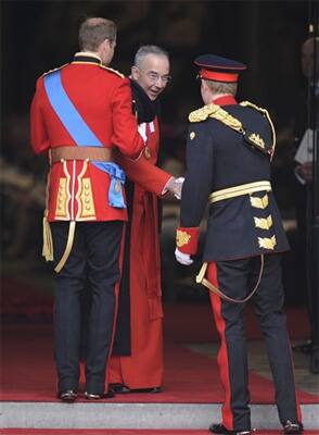 The Dean of Westminster John Hall shakes hands with Prince Harry and Prince William at Westminster Abbey at the Royal Wedding with Kate Middleton in London.