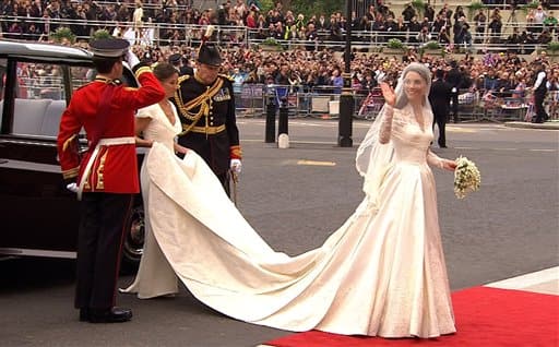 Kate Middleton waves as she arrives at Westminster Abbey for the Royal Wedding in London.