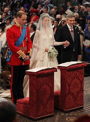 Prince William and Kate Middleton stand at the altar with Kate's father Michael Middleton inside Westminster Abbey where the couple will marry .