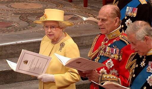 Britain's Queen Elizabeth II, Britain's Prince Philip, and Britain's Prince Charles sing during the ceremony at Westminster Abbey.