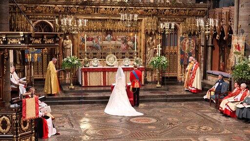 Britain's Prince William, center right, and Kate Middleton, center left, stand at the altar during their wedding service at Westminster Abbey.