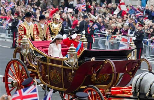 Britain's Prince William salutes and his wife Kate, the Duchess of Cambridge, bows her head, as they approach the Cenotaph, the memorial to Britain's war deadfollowing their wedding in London's Westminster Abbey.