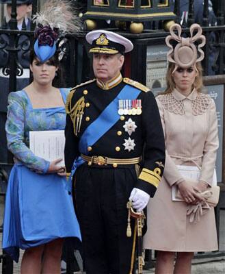 Britain's Prince Andrew, center, and his daughters Britain's Princess Eugenie, left, and Britain's Princess Beatrice leave Westminster Abbey.