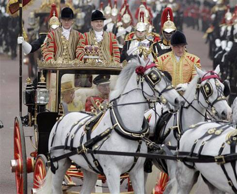 Britain's Queen Elizabeth II and Britain's Prince Philip make their way down the Mall to Buckingham Palace after the Royal Wedding.