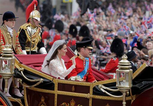 Britain's Prince William and his wife Kate, Duchess of Cambridge make their way to Buckingham Palace after the Royal Wedding.