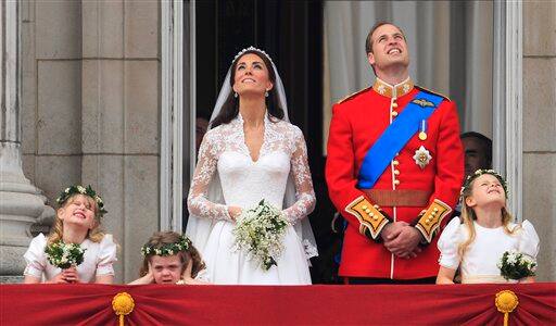 Britain's Prince William and his wife Kate, Duchess of Cambridge watch a fly past of military planes.