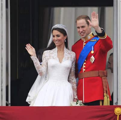 Britain's Prince William and his wife Kate, Duchess of Cambridge wave from the balcony of Buckingham Palace.