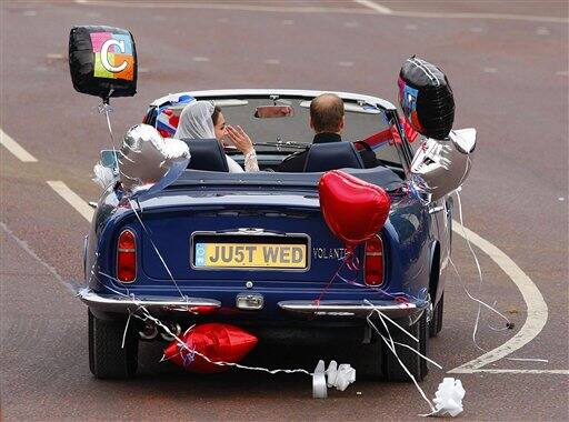 Britain's Prince William drives himself and his wife Kate. Duchess of Cambridge, as they leave Buckingham Palace for Clarence House, following ineir wedding in London.