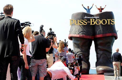 Actors Antonio Banderas, left, and Salma Hayek pose during a photo call for Puss in Boots, at the 64th international film festival, in Cannes.