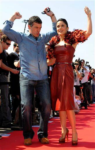 Actors Antonio Banderas, left, and Salma Hayek pose during a photo call for Puss in Boots, at the 64th international film festival, in Cannes.