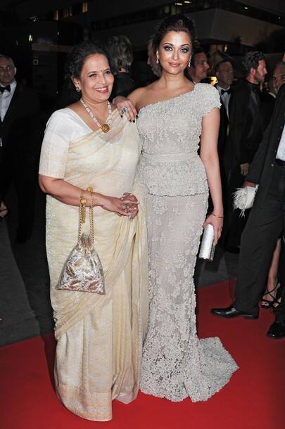 Aishwarya Rai Bachchan and guest attend the opening night dinner during the 64th Annual Cannes Film Festival at Palais des Festivals on May 11, 2011 in Cannes, France.