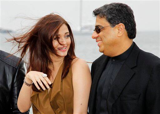 Actress Aishwarya Rai and UTV CEO Ronnie Screwvala pose during a photo call for Heroine at the 64th international film festival, in Cannes.