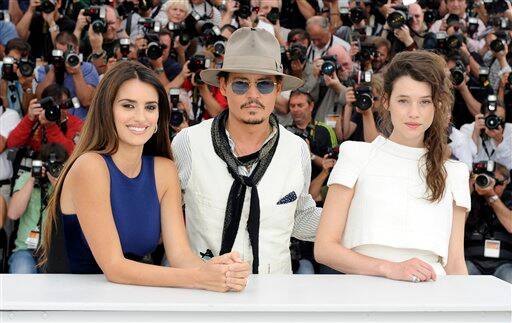 From left, actors Penelope Cruz, Johnny Depp and Astrid Berges-Frisbey pose during a photo call for Pirates of the Caribbean: On Stranger Tides.