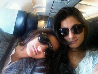 Sonam and Rhea Kapoor pose for a candid shot while on their way to Cannes. 