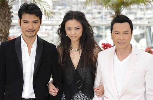 Actors Takeshi Kaneshiro, Tang Wei, and Donnie Yen pose during a photo call for Wu Xia, at the 64th international film festival, in Cannes.