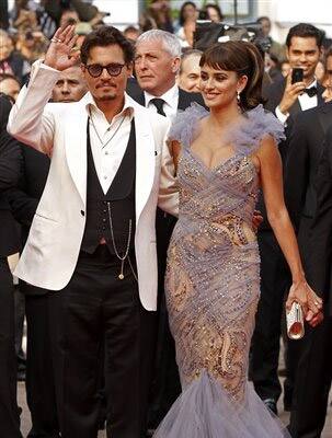 Actors Johnny Depp, left, and Penelope Cruz arrive for the screening of Pirates of the Caribbean: On Stranger Tides, at the 64th international film festival, in Cannes.